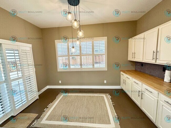 Building Photo - Open Kitchen, Expansive Living, and Covered Patio in Tranquil South Reno Near Trails, Parks & Sho...