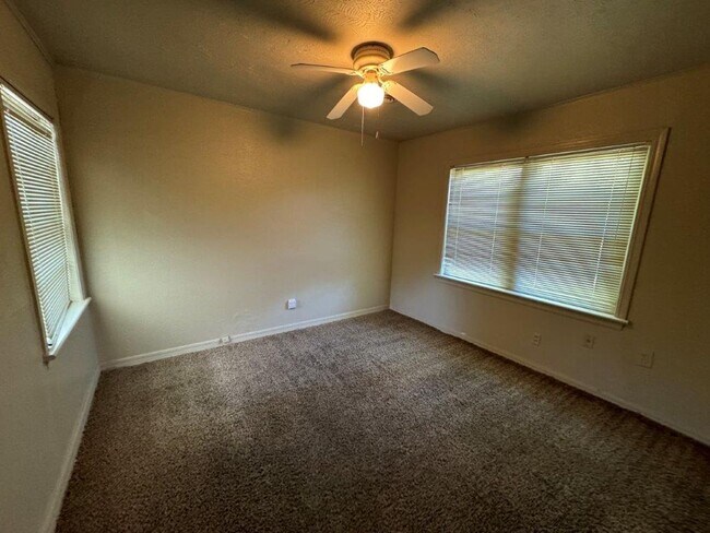 Building Photo - Mowing Included!  Lots of character, wood vinyl flooring and carpet, large, fenced yard, ready fo...