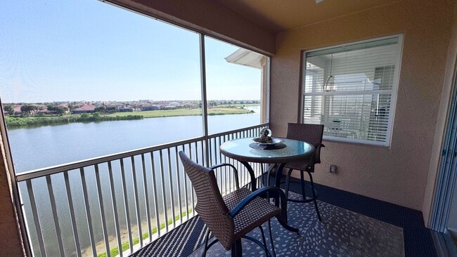 Building Photo - Elevated Luxury at The Terraces – 4th Floor Lake & Golf Course Views! 55+ Community!