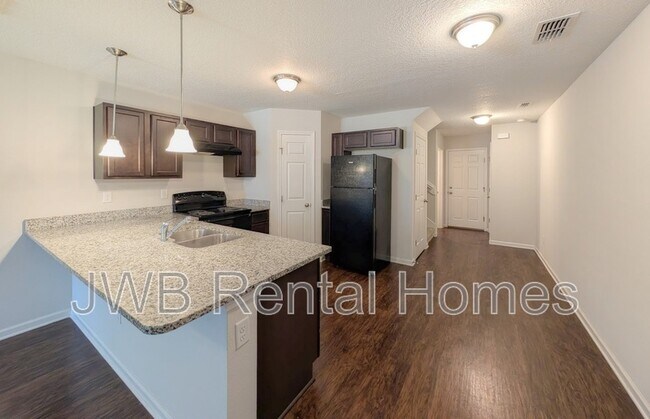 Building Photo - 8431 McGirts Village Ln