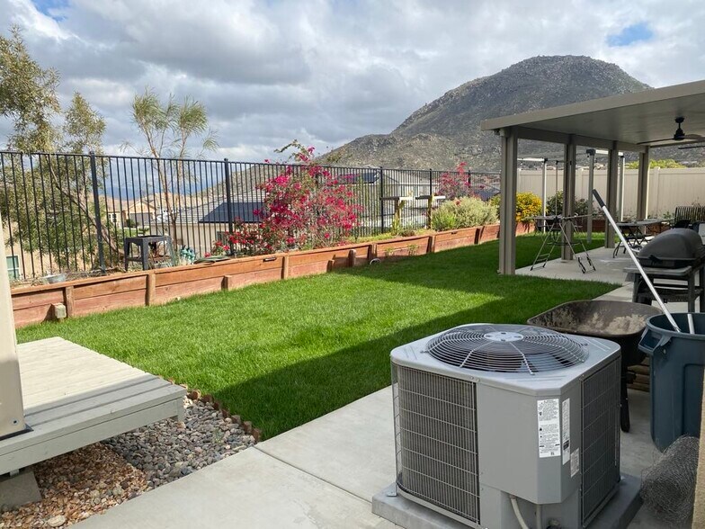 grass backyard with patio - 7893 Boot Straps Ct