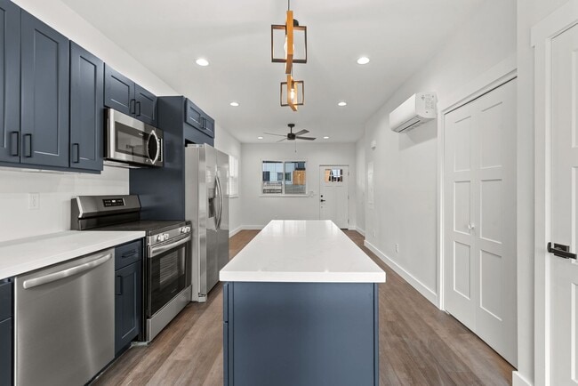 Building Photo - Brand new 2 bed/2 bath, central a/c, dishwasher, washer & dryer, deck & patio! April rent free!