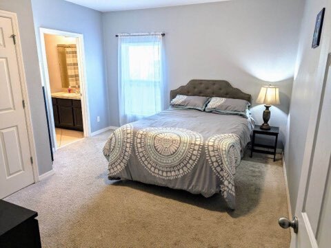 2nd master bedroom on main floor with en suite bathroom - 192 Whispering Pines Way