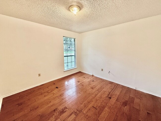 Building Photo - Charming 3BR/2BA Brick Home in Perkins Village – Spacious Yard & Cozy Fireplace