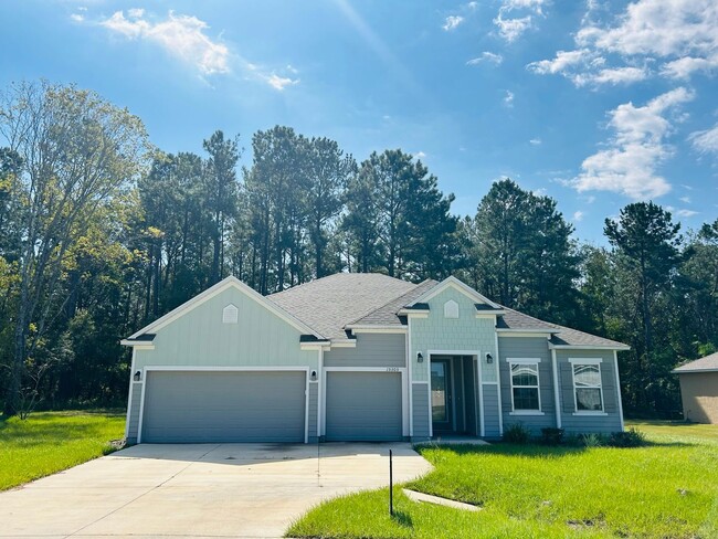 Building Photo - 4/3 + Bonus Room with 3 Car Garage on 1/2 ...