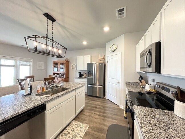 Building Photo - 4-Bedroom w/ Open Layout & Community Perks