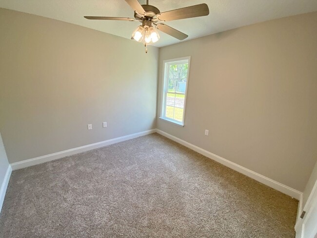 Building Photo - $500 Move-in Discount! Modern 4-Bedroom Home with Fenced Yard Near Moody AFB