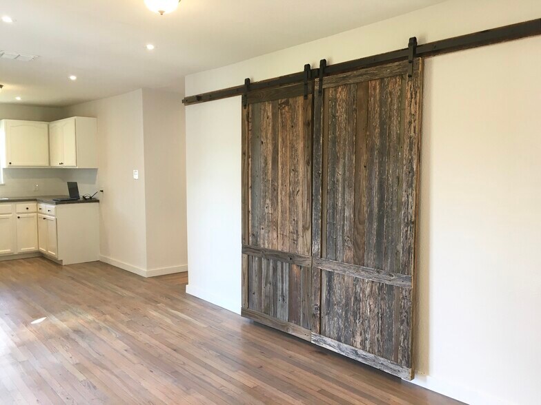 Utility room with barn doors - 5131 Wildflower Dr