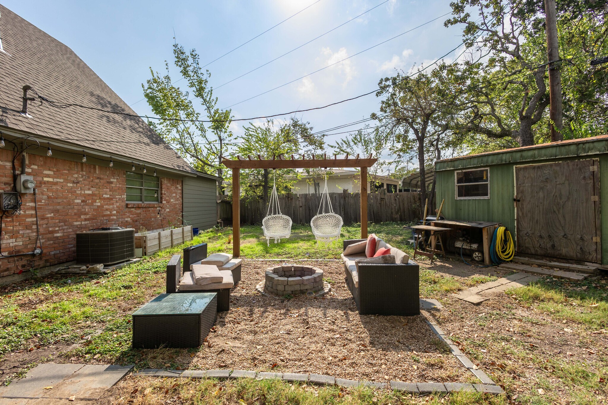 Backyard firepit with pergola swinset. - 604 Avondale Ave