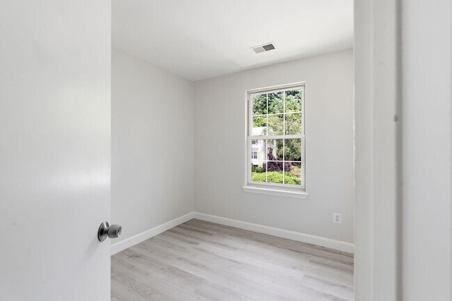 Building Photo - Experience contemporary living in this beautifully renovated residence where modern design meets ...