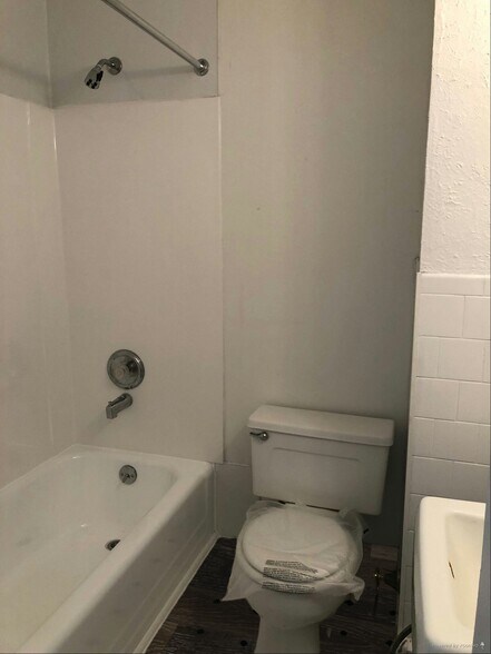 Bathroom Showing Example of New LVP Flooring (Photo of downstairs unit with same layout) - 109 W Brigantine Ave