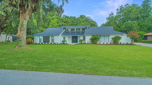 Building Photo - Beautifully Updated 3/2 Pool Home with Large Backyard in Lake Ajay (Gated Community)