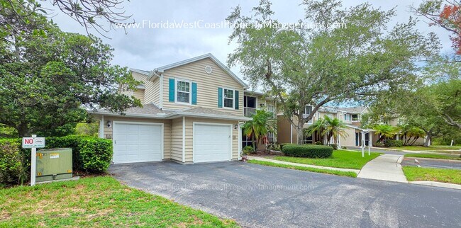 Building Photo - MOVE IN READY! LARGE 2 BEDROOM/2 BATH PLUS ATTACHED GARAGE! TILE/LVP THROUGHOUT!