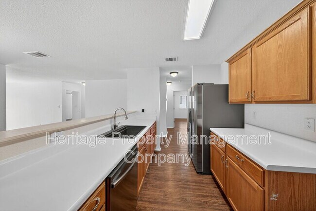 Building Photo - 4935 Dahlia Terrace