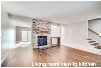 Family room looking toward kitchen nook, slider to deck - 7152 E Briarwood Cir