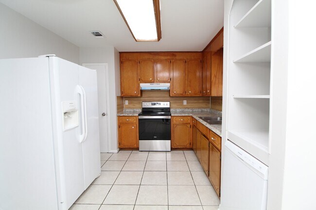 Building Photo - Charming 3-Bedroom Brick Home on Half an A...