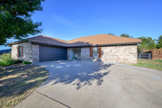 Ranch-style house with an attached 2 car garage. - 209 Prairie Wind Blvd