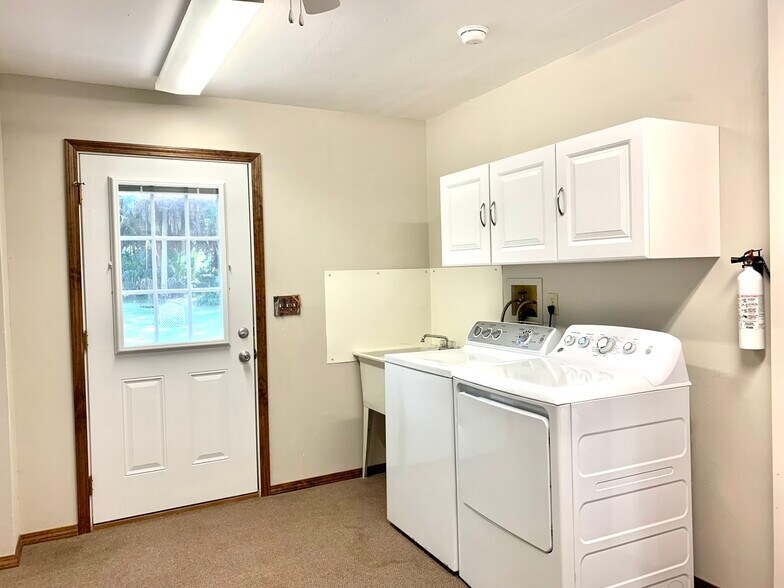 Spacious laundry/storage room. - 5203 15th St W