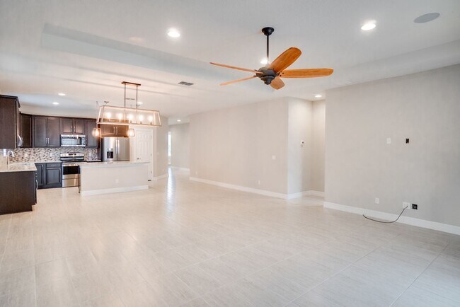 Building Photo - Stunning 3-Bedroom Pool Home with Bonus Room in the Gated Community of Lakeshore at Narcoossee