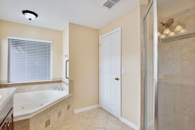 Building Photo - Luxury 3BR/3BA Townhome with 2-Car Garage in Gated Greystone – Sanford