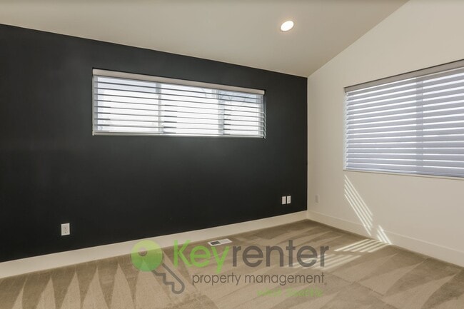 Building Photo - Spacious Living with Balconies, Deck, and Private Yard