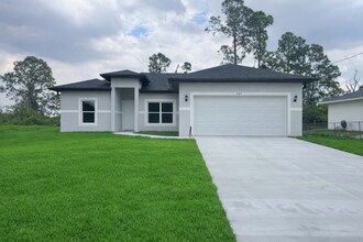 Building Photo - NEW CONSTRUCTION-Spacious 4 Bed / 2 Bath / 2 Car Garage Home in Lehigh Acres