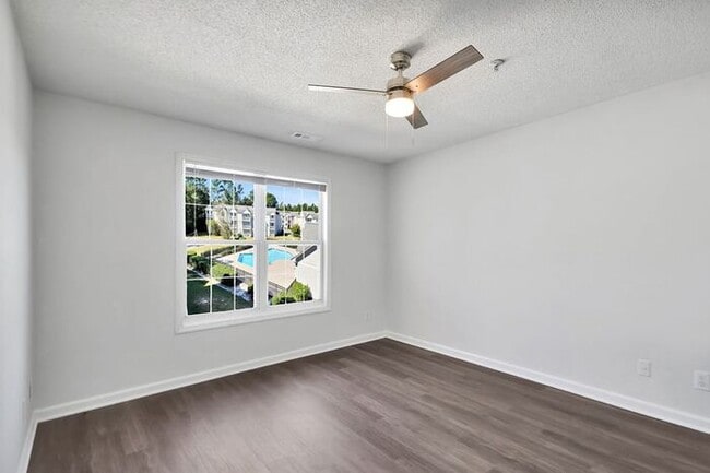 Building Photo - RENT SPECIAL! Freshly Painted! New Luxury ...