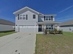 Building Photo - Spacious 5-Bedroom Home in Shoal River Community with Modern Features and Community Pool Access!