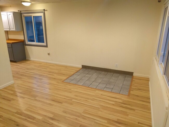 Living room (this tile section is gone and all flooring is the same). - 4225 Sheffield Road