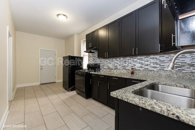 Building Photo - 7642 S Normal Ave