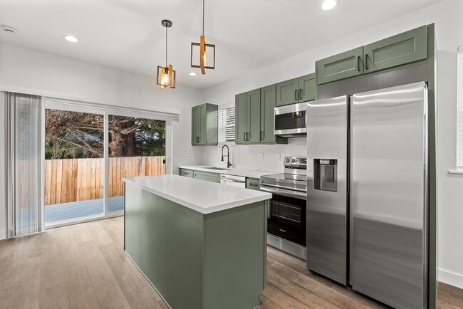 Building Photo - Brand new 2 bed/2 bath, central a/c, dishwasher, washer & dryer, deck & patio! April rent free!