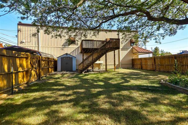 Fenced yard with a shed - 514 Windsor Rd