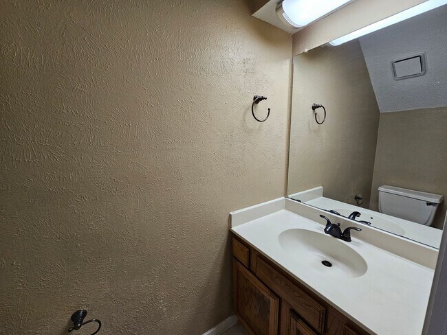 Building Photo - Stunning two-level, two-bedroom, one-and-a-half-bathroom townhome