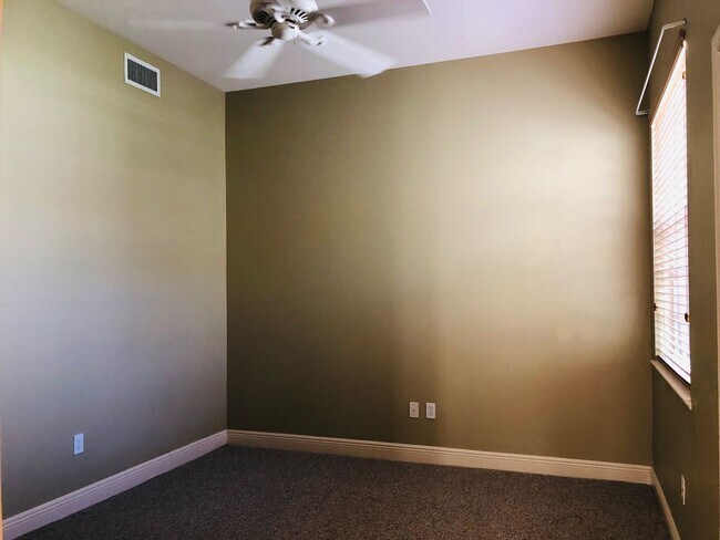 Building Photo - Experience Bell Tower Park. GATED ground floor 2 Bed 2 Bath Den 1 Car Garage Condo.