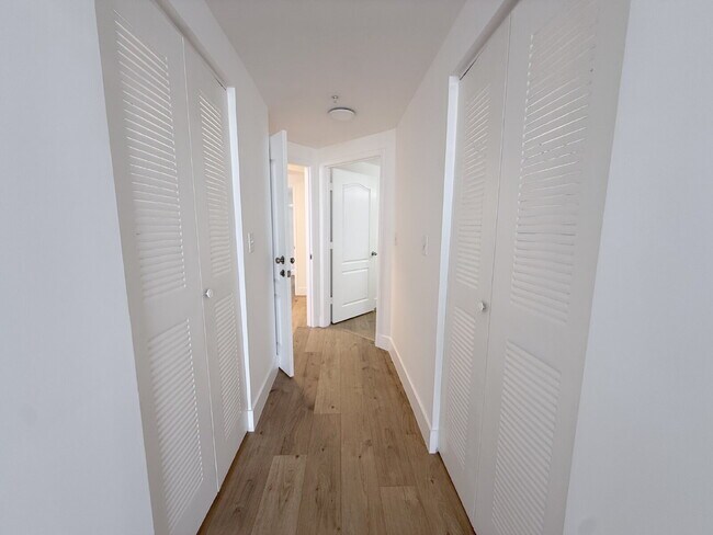 Building Photo - Rare 2/2 Corner Penthouse with Panoramic Lagoon Views from Every Room – Available Now!