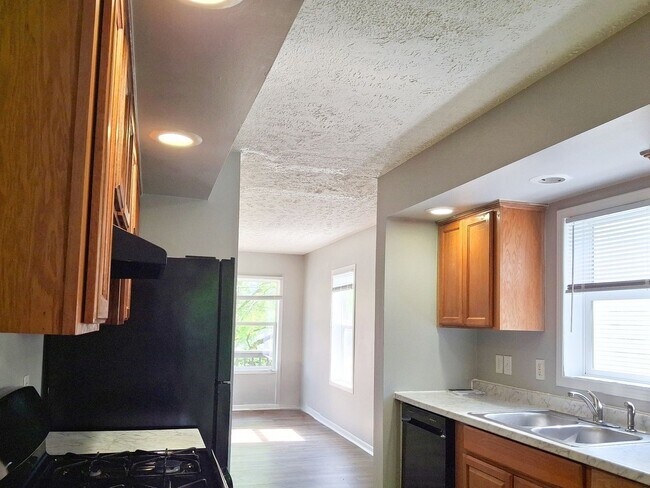 Building Photo - 4 Bed / 2 Full Bath House on a Quiet Dead-End Street — Attached Garage, Central A/C, W/D Hookups ...