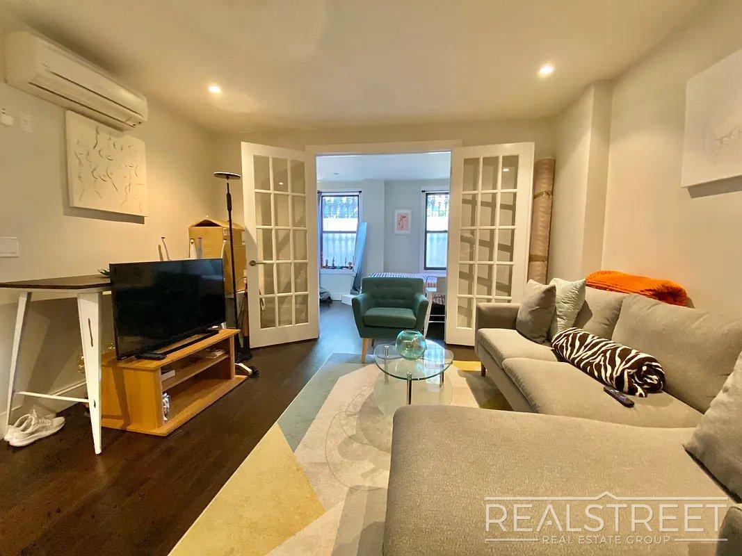 Building Photo - Modern Ground-Floor 1 Bedroom with Gym, Roof Deck & Courtyard in Prime Williamsburg
