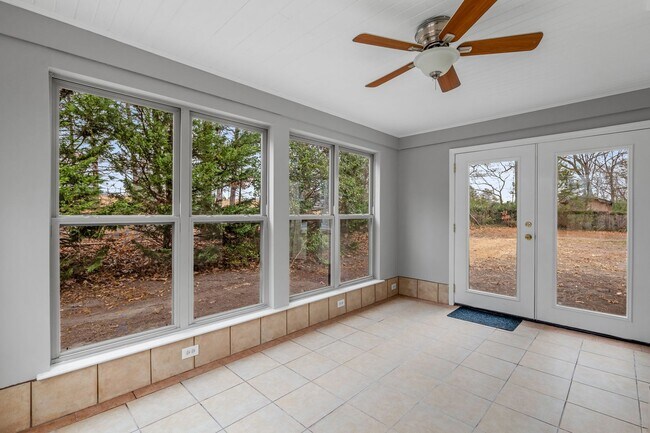 Building Photo - Brick home, Two Story, Hardwoods, DR, 2 Sun Rooms, FP, Carport!.