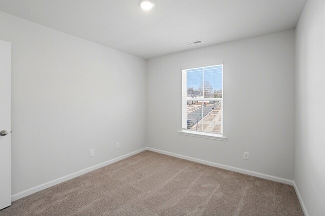 Building Photo - 4BR Home in The Pines at Paw Creek – New Construction + Private Deck