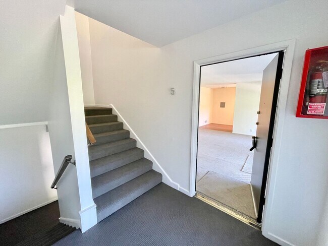 Building Photo - Sunlit 2BD/1BA w/ Private Balcony + Backyard! New Carpet! Assigned Parking! PROGRESSIVE