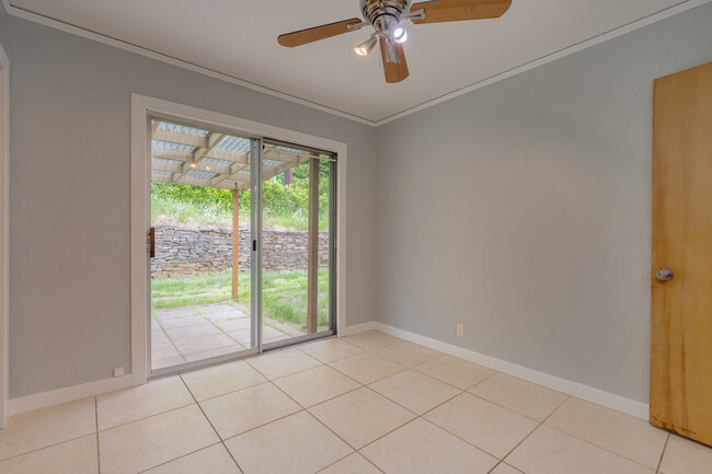 A small covered patio is just outside the bedroom - 211 Farview Drive