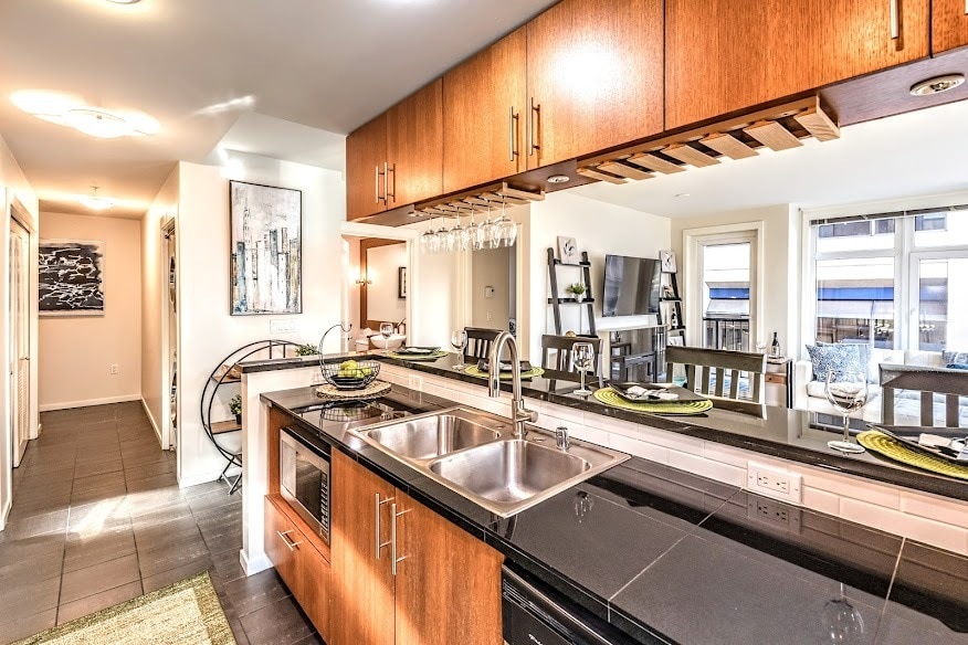 Roomy galley kitchen with bar seating for cooking & entertaining - 2721 1st Ave