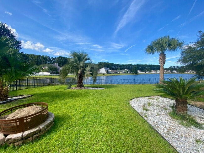 Building Photo - Three Bedroom Home with fenced-in Backyard oasis!