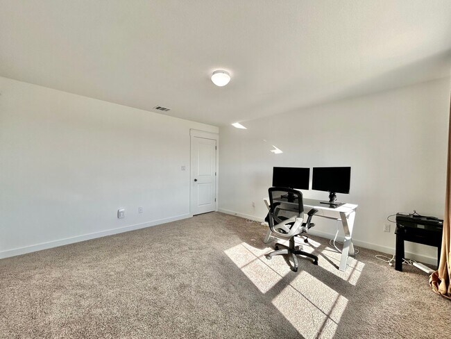 Building Photo - Inviting 4-Bed, 2.5-Bath Home with High Ceilings and Covered Deck