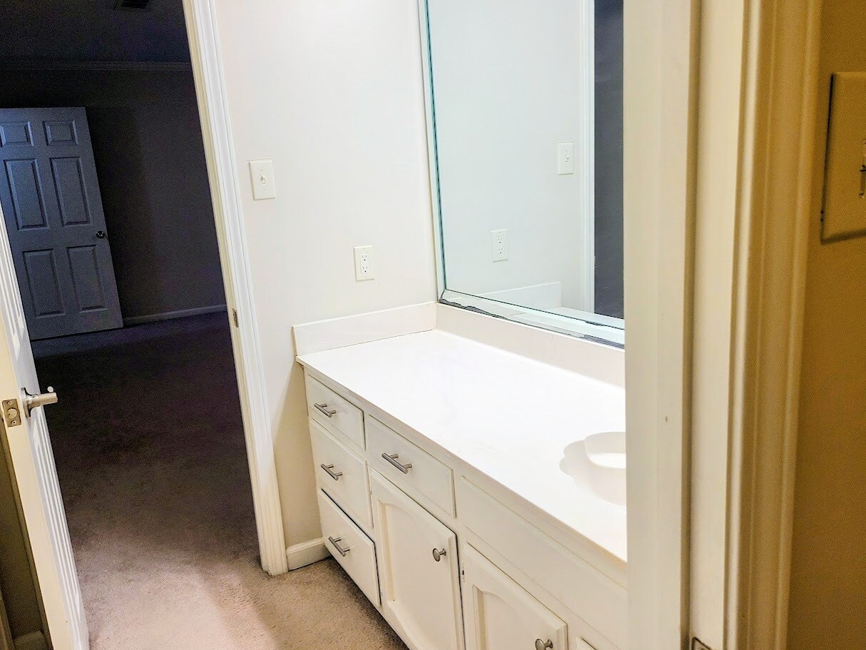 Master bath with large vanity and additional storage - 12439 Coursey Blvd