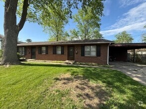 Building Photo - Brick Duplex with Fenced Yard on a Quiet S...