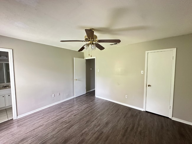 Building Photo - Charming 3BR/2BA Near Southwind | Soaring Vaulted Ceilings, Rustic Fireplace & Garage