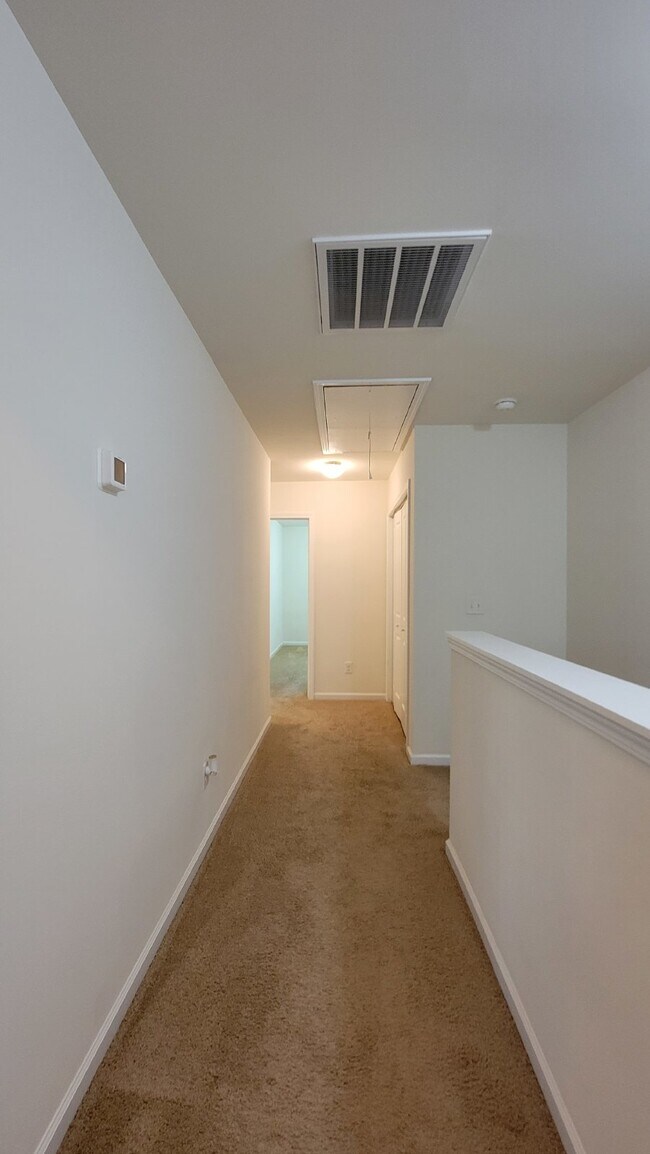 Building Photo - "Modern 3-Bedroom Multiplex with 3 Full Ba...