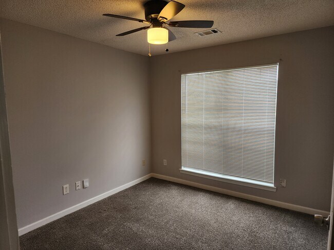 Secondary bedrooms located on opposite side of home from owners suite - 1072 Meadow Glen Cir