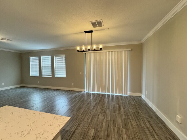 Building Photo - "Spacious 4-Bed Home with Granite Countert...